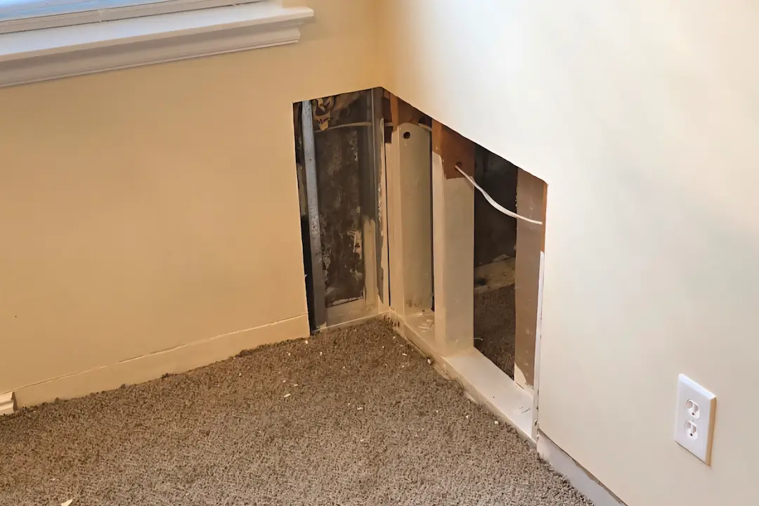 Drywall repair and baseboard restoration before in Millcreek Utah