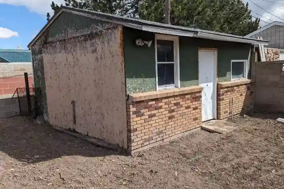 Shed before vinyl siding restoration in Salt Lake City