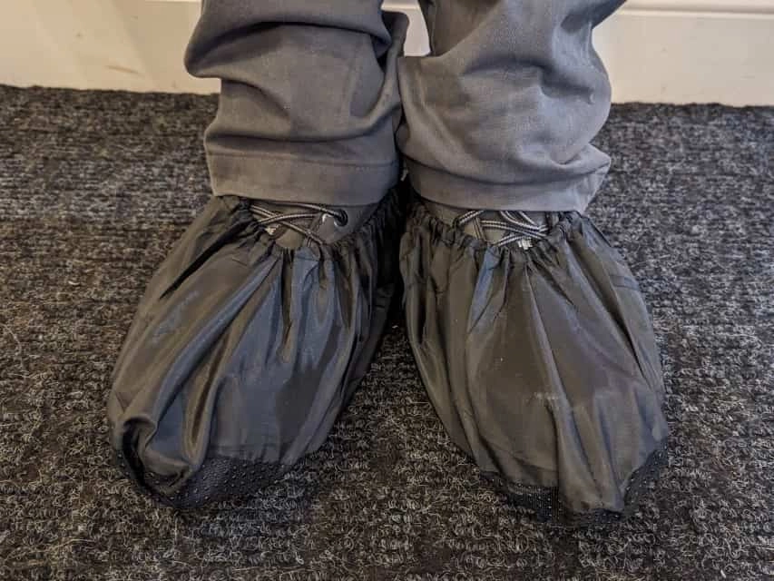 Handyman wearing shoe covers before entering a customer's home